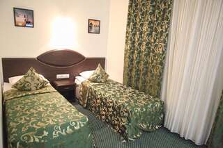 Гостиница Ринг Волгоград  Двухместный номер эконом-класса с 2 отдельными кроватями-1